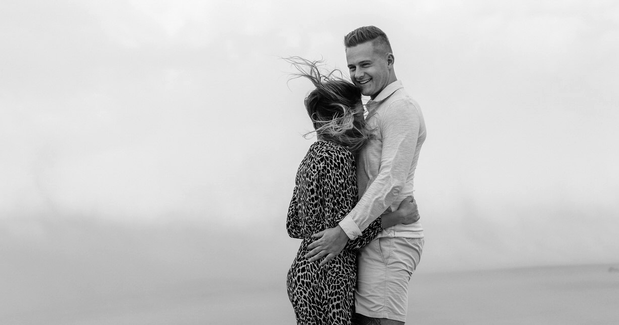 Tbilisi Wedding Photographer bride and groom together in hug. Simple black and white wedding image with clean background
